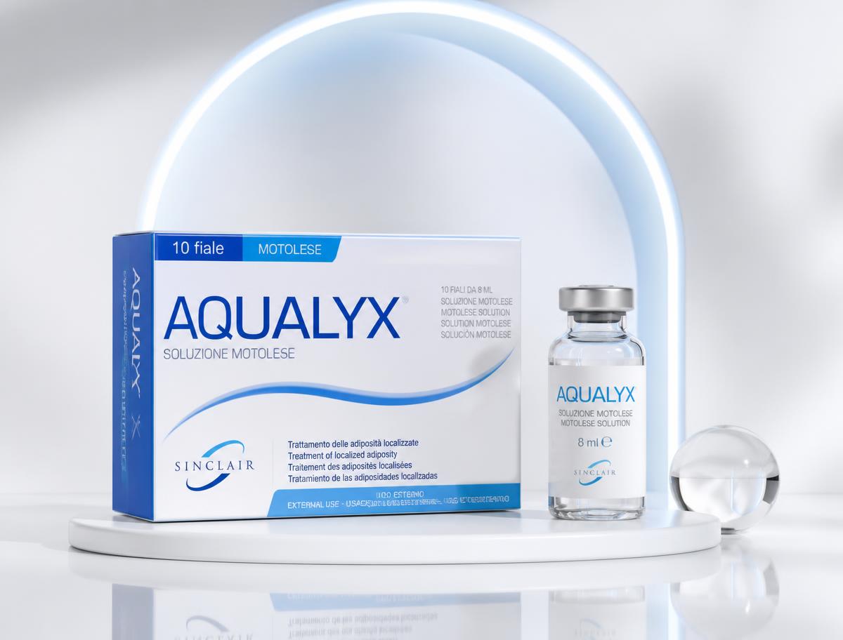 Aqualyx boxes and vials on a glossy white platform with a softly illuminated blue arch